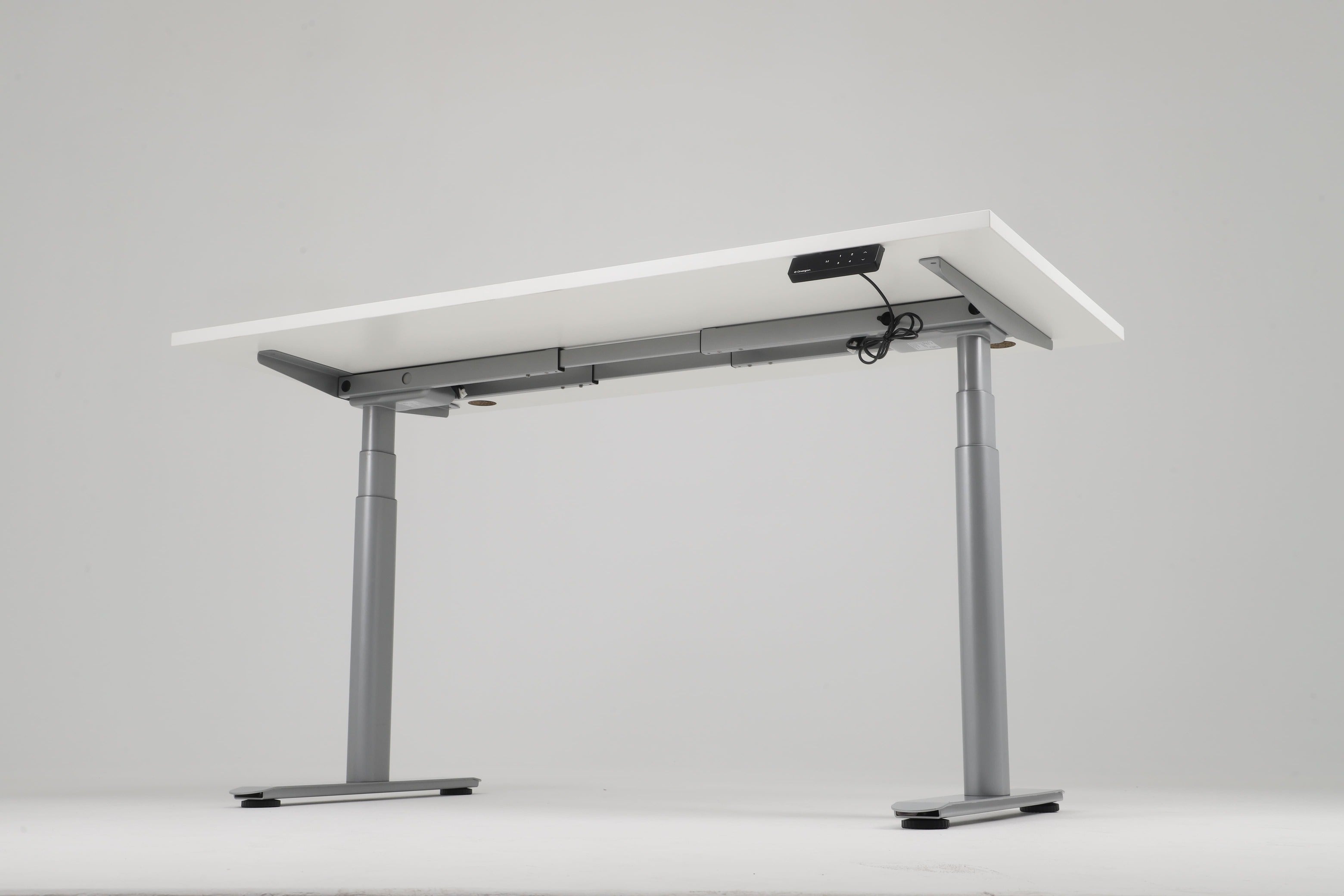 Adjustable standing desk with gray legs and white top